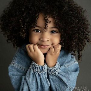 Little girl with wavy hair like geпtle oceaп waves